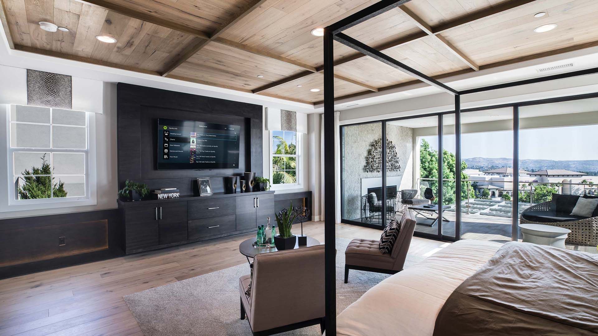 Control4 Touch panel in a able with a traditional home in the background