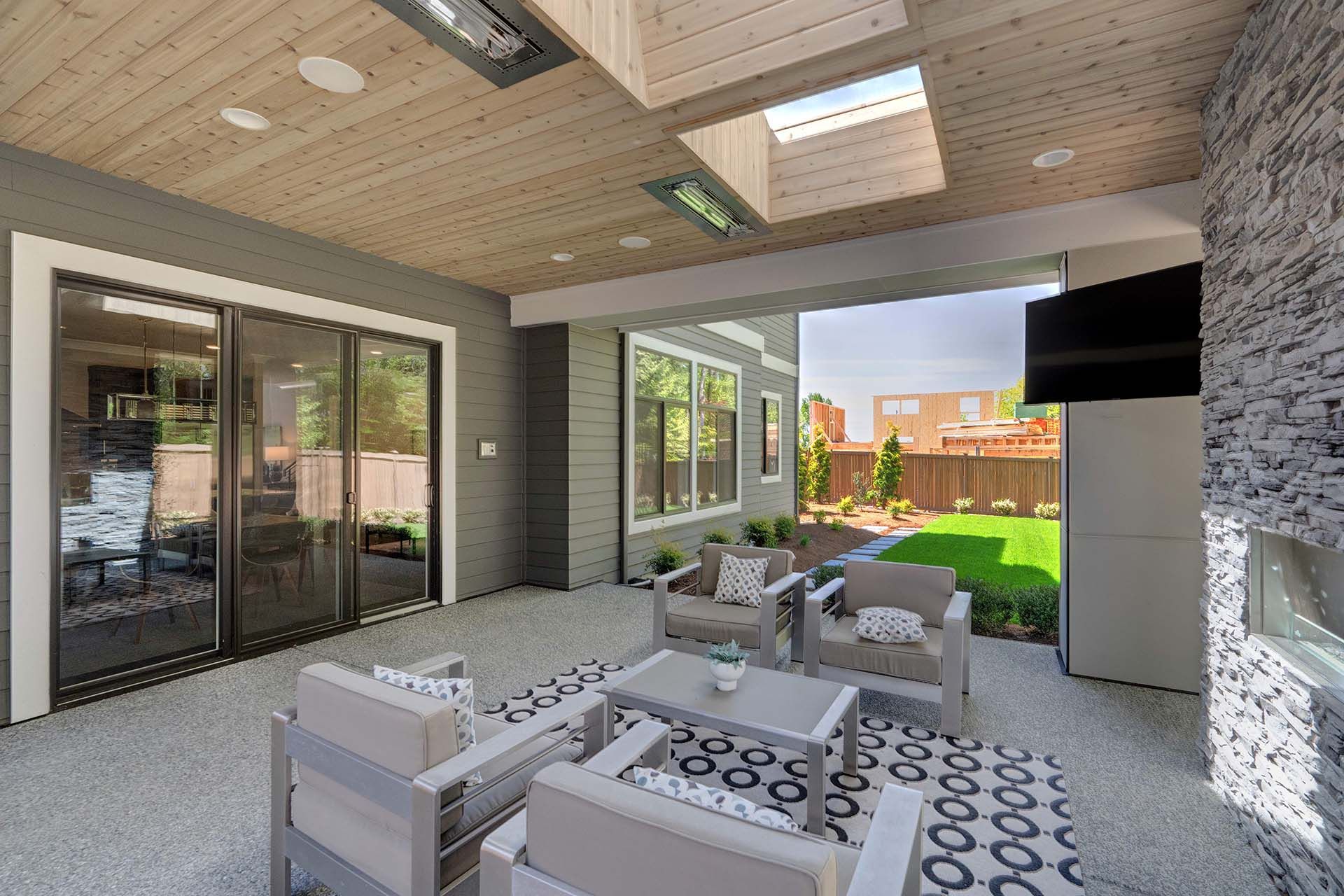 Patio with couches and flat screen TV